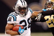 NEW ORLEANS - DECEMBER 28: Jonathan Stewart #28 of the Carolina Panthers is pushed out of bounds by Randall Gay #20 of the New Orleans Saints on December 28, 2008 at the Superdome in New Orleans, Louisiana. The Panthers defated the Saints 33-31.  (Photo by Chris Graythen/Getty Images)