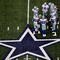 ARLINGTON, TX - NOVEMBER 01:  Quarterback Tony Romo #9 of the Dallas Cowboys huddles the offense at Cowboys Stadium on November 1, 2009 in Arlington, Texas.  (Photo by Ronald Martinez/Getty Images)