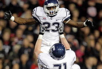 CINCINNATI - NOVEMBER 07:  Jordan Todman #23 of the Connecticut Huskies celebrates with Mike Ryan #71 after running for a touchdownl against the Cincinnati Bearcats during the Big East Conference game at Nippert Stadium on November 7, 2009 in Cincinnati, Ohio.  (Photo by Andy Lyons/Getty Images)