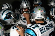 GLENDALE, AZ - NOVEMBER 01:  Gary Barnidge #82 and quarterback Jake Delhomme #17 of the Carolina Panthers huddle up before the NFL game against the Arizona Cardinals at the Universtity of Phoenix Stadium on November 1, 2009 in Glendale, Arizona. The Panthers defeated the Cardinals 34-21.  (Photo by Christian Petersen/Getty Images)