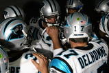 GLENDALE, AZ - NOVEMBER 01:  Gary Barnidge #82 and quarterback Jake Delhomme #17 of the Carolina Panthers huddle up before the NFL game against the Arizona Cardinals at the Universtity of Phoenix Stadium on November 1, 2009 in Glendale, Arizona. The Panthers defeated the Cardinals 34-21.  (Photo by Christian Petersen/Getty Images)