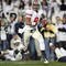 STATE COLLEGE, PA - NOVEMBER 7: Wide receiver DeVier Posey #8 of the Ohio State Buckeyes catches a 62 yard touchdown pass during a game against the Penn State Nittany Lions on November 7, 2009 at Beaver Stadium in State College, Pennsylvania. Ohio State won 24-7. (Photo by Hunter Martin/Getty Images)