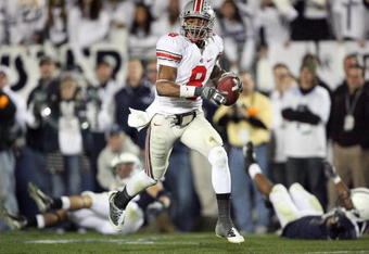 STATE COLLEGE, PA - NOVEMBER 7: Wide receiver DeVier Posey #8 of the Ohio State Buckeyes catches a 62 yard touchdown pass during a game against the Penn State Nittany Lions on November 7, 2009 at Beaver Stadium in State College, Pennsylvania. Ohio State won 24-7. (Photo by Hunter Martin/Getty Images)