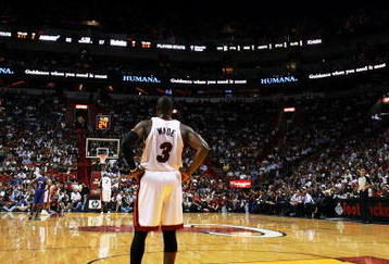 MIAMI - OCTOBER 28:  Dwyane Wade #3 of the Miami Heat watches as his team shoots free-throws on the other end of the court against the New York Knicks at AmericanAirlines Arena on October 28, 2009 in Miami, Florida. The Heat defeated the Knicks 115-93. NOTE TO USER: User expressly acknowledges and agrees that, by downloading and/or using this Photograph, user is consenting to the terms and conditions of the Getty Images License Agreement.  (Photo by Doug Benc/Getty Images)