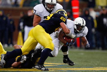 ANN ARBOR, MI - OCTOBER 24:  Mike Martin #68 of the Michigan Wolverines tackles Brandon Beachum #3 of the Penn State Nittany Lions on October 24, 2009 at Michigan Stadium in Ann Arbor, Michigan. (Photo by  Gregory Shamus/Getty Images)