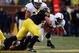 ANN ARBOR, MI - OCTOBER 24:  Mike Martin #68 of the Michigan Wolverines tackles Brandon Beachum #3 of the Penn State Nittany Lions on October 24, 2009 at Michigan Stadium in Ann Arbor, Michigan. (Photo by  Gregory Shamus/Getty Images)