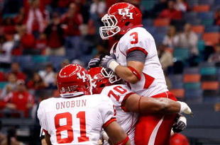NEW ORLEANS - OCTOBER 17:  Justin Johnson #3 of the Houston Cougars celebrates after a touchdown against the Tulane Green Wave at the Louisiana Superdome on October 17, 2009 in New Orleans, Louisiana.  The Cougars defeated the Green Wave 44-16.  (Photo by Chris Graythen/Getty Images)