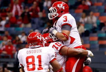 NEW ORLEANS - OCTOBER 17:  Justin Johnson #3 of the Houston Cougars celebrates after a touchdown against the Tulane Green Wave at the Louisiana Superdome on October 17, 2009 in New Orleans, Louisiana.  The Cougars defeated the Green Wave 44-16.  (Photo by Chris Graythen/Getty Images)