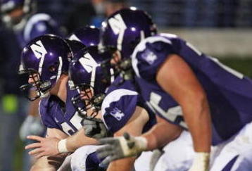 EVANSTON, IL - OCTOBER 31: Ben Burkett #65 of the Northwestern Wildcats prepares to snap the ball against the Penn State Nittany Lions at Ryan Field on October 31, 2009 in Evanston, Illinois. Penn State defeated Northwestern 34-13. (Photo by Jonathan Daniel/Getty Images)