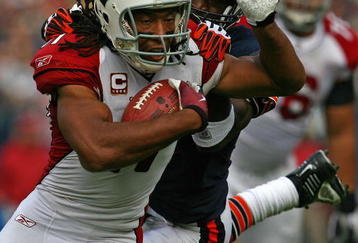 CHICAGO - NOVEMBER 08: Larry Fitzgerald #11 of the Arizona Cardinals shakes off a tackle attempt by Charles Tillman #33 of the Chicago Bears to score a touchdown at Soldier Field on November 8, 2009 in Chicago, Illinois. (Photo by Jonathan Daniel/Getty Images)