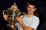 BASEL, SWITZERLAND - NOVEMBER 08:  Novak Djokovic of Serbia celebrates with the trophy after defeating Roger Federer of Switzerland in the final during Day Seven of the Davidoff Swiss Indoors Tennis at St Jakobshalle on November 8, 2009 in Basel, Switzerland.  (Photo by Julian Finney/Getty Images)
