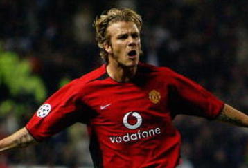 MANCHESTER - APRIL 23:   David Beckham of Manchester United celebrates scoring during the UEFA Champions League quarter final, second leg match between Manchester United and Real Madrid held on April 23, 2003 at Old Trafford in Manchester, England.  Manchester United won the match 4-3, but lost the tie 6-5 on aggregate.  (Photo by Laurence Griffiths/Getty Images)