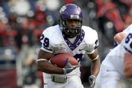 SAN DIEGO - NOVEMBER 07: Running back Matthew Tucker #29 of the Texas Christian University Horned Frogs carries the ball at the start of a 30 yard touchdown run in the third quarter against the San Diego State Aztecs on November 7, 2009 at Qualcomm Stadium in San Diego, California. TCU won 55-12. (Photo by Stephen Dunn/Getty Images)