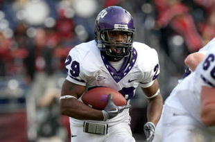 SAN DIEGO - NOVEMBER 07:  Running back Matthew Tucker #29 of the Texas Christian University Horned Frogs carries the ball at the start of a 30 yard touchdown run in the third quarter against the San Diego State Aztecs on November 7, 2009 at Qualcomm Stadium in San Diego, California.   TCU won 55-12.  (Photo by Stephen Dunn/Getty Images)