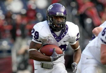 SAN DIEGO - NOVEMBER 07:  Running back Matthew Tucker #29 of the Texas Christian University Horned Frogs carries the ball at the start of a 30 yard touchdown run in the third quarter against the San Diego State Aztecs on November 7, 2009 at Qualcomm Stadium in San Diego, California.   TCU won 55-12.  (Photo by Stephen Dunn/Getty Images)