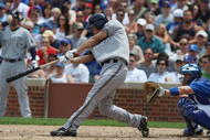 CHICAGO - JULY 03:  J.J. Hardy #7 of the Milwaukee Brewers at bat against the Chicago Cubs during their MLB game on July 3, 2009 at Wrigley Field in Chicago, Illinois. (Photo by Jonathan Daniel/Getty Images) 