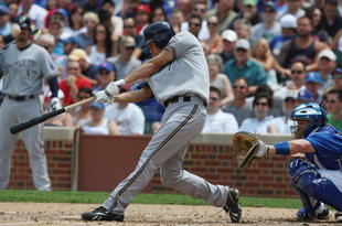 CHICAGO - JULY 03:  J.J. Hardy #7 of the Milwaukee Brewers at bat against the Chicago Cubs during their MLB game on July 3, 2009 at Wrigley Field in Chicago, Illinois. (Photo by Jonathan Daniel/Getty Images) 