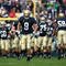 SOUTH BEND, IN - OCTOBER 03: Kyle Rudolph #9 of the Notre Dame Fighting Irish runs onto the field with teammates before a game against the Washington Huskies on October 3, 2009 at Notre Dame Stadium in South Bend, Indiana. Notre Dame defeated Washington 37-30 in overtime. (Photo by Jonathan Daniel/Getty Images)