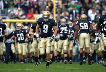 SOUTH BEND, IN - OCTOBER 03: Kyle Rudolph #9 of the Notre Dame Fighting Irish runs onto the field with teammates before a game against the Washington Huskies on October 3, 2009 at Notre Dame Stadium in South Bend, Indiana. Notre Dame defeated Washington 37-30 in overtime. (Photo by Jonathan Daniel/Getty Images)