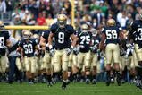 SOUTH BEND, IN - OCTOBER 03: Kyle Rudolph #9 of the Notre Dame Fighting Irish runs onto the field with teammates before a game against the Washington Huskies on October 3, 2009 at Notre Dame Stadium in South Bend, Indiana. Notre Dame defeated Washington 37-30 in overtime. (Photo by Jonathan Daniel/Getty Images)