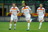 MILAN, ITALY - NOVEMBER 08: Mirko Vucinic (C) of AS Roma celebrates his goal during the Serie A match between FC Internazionale and AS Roma at Stadio Giuseppe Meazza on November 08, 2009 in Milan, Italy. (Photo by Valerio Pennicino/Getty Images)