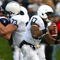 EVANSTON, IL - OCTOBER 31: Daryll Clark #17 of the Penn State Nittany Lions runs with the ball as teammate Dennis Landolt #73 blocks Vince Browne #94 of the Northwestern Wildcats at Ryan Field on October 31, 2009 in Evanston, Illinois. Penn State defeated Northwestern 34-13. (Photo by Jonathan Daniel/Getty Images)