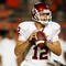 MIAMI GARDENS, FL - OCTOBER 03:  Quarterback Landry Jones #12 of the Oklahoma Sooners drops back to pass against the Miami Hurricanes at Land Shark Stadium on October 3, 2009 in Miami Gardens, Florida. Miami defeated Oklahoma 21-20.  (Photo by Doug Benc/Getty Images)