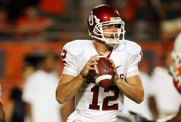 MIAMI GARDENS, FL - OCTOBER 03:  Quarterback Landry Jones #12 of the Oklahoma Sooners drops back to pass against the Miami Hurricanes at Land Shark Stadium on October 3, 2009 in Miami Gardens, Florida. Miami defeated Oklahoma 21-20.  (Photo by Doug Benc/Getty Images)