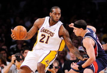 LOS ANGELES, CA - NOVEMBER 01:  Josh Powell #21 of the Los Angeles Lakers drives against the Atlanta Hawks during the NBA basketball game at Staples Center on November 1, 2009 in Los Angeles, California. NOTE TO USER: User expressly acknowledges and agrees that, by downloading and/or using this Photograph, user is consenting to the terms and conditions of the Getty Images License Agreement.  (Photo by Kevork Djansezian/Getty Images)