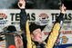 FORT WORTH, TX - NOVEMBER 08:  Kurt Busch, driver of the #2 Miller Lite Dodge, celebrates by firing two Beretta's into the air on victory lane after winning the NASCAR Sprint Cup Series Dickies 500 at Texas Motor Speedway on November 8, 2009 in Fort Worth, Texas.  (Photo by Tom Pennington/Getty Images for NASCAR)