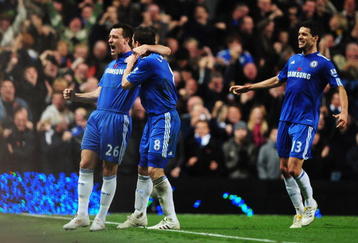 LONDON, ENGLAND - NOVEMBER 08:  John Terry (L) of Chelsea celebrates with teammate Frank Lampard (C) and Michael Ballack (R)  after scoring the opening goal during the Barclays Premier League match between Chelsea and Manchester United at Stamford Bridge on November 8, 2009 in London, England.  (Photo by Clive Mason/Getty Images)