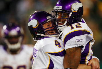 GREEN BAY, WI - NOVEMBER 01: Quarterback Brett Favre #4 of the Minnesota Vikings celebrates with teammate Percy Harvin #12 after a 51 yard touchdown pass during the third quarter of the game against the Green Bay Packers at Lambeau Field on November 1, 2009 in Green Bay, Wisconsin. (Photo by Scott Boehm/Getty Images)