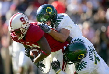 PALO ALTO, CA - NOVEMBER 07:  Chris Owusu #81 of the Stanford Cardinal is tackled by the Oregon Ducks at Stanford Stadium on November 7, 2009 in Palo Alto, California.  (Photo by Ezra Shaw/Getty Images)