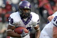 SAN DIEGO - NOVEMBER 07:  Running back Matthew Tucker #29 of the Texas Christian University Horned Frogs carries the ball at the start of a 30 yard touchdown run in the third quarter against the San Diego State Aztecs on November 7, 2009 at Qualcomm Stadium in San Diego, California.   TCU won 55-12.  (Photo by Stephen Dunn/Getty Images)