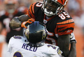 CINCINNATI - NOVEMBER 8: Chad Ochocinco #85 of the Cincinnati Bengals is tackled by Ed Reed #20 of the Baltimore Ravens at Paul Brown Stadium on November 8, 2009 in Cincinnati, Ohio.  (Photo by John Sommers II/Getty Images)