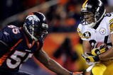 DENVER - OCTOBER 21:  Hines Ward #86 of the Pittsburgh Steelers makes a reception as D.J. Williams #55 of the Denver Broncos defends at Invesco Field at Mile High on October 21, 2007 in Denver, Colorado. The Broncos defeated the Steelers 31-28.  (Photo by Doug Pensinger/Getty Images)