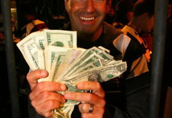 DAVIDSON, NC - OCTOBER 14:  NASCAR driver Marcos Ambrose shows money raised after he was locked up for charity at the NASCAR Second Annual Jail & Bail held at Brickhouse Tavern  October 14, 2009 in Davidson, North Carolina.  Funds raised during the event will go to The NASCAR Foundation and Brienne Davis Scholarship Fund.  (Photo by Jason Smith/Getty Images)