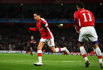 LONDON, ENGLAND - NOVEMBER 04:  Samir Nasri (C) of Arsenal celebrates scoring the second goal of the game with team mate Robin Van Persie during the UEFA Champions League Group H match between Arsenal and AZ Alkmaar at the Emirates Stadium on November 4, 2009 in London, England.  (Photo by Phil Cole/Getty Images)