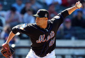 NEW YORK - MAY 13:  Pedro Feliciano #25 of the New York Mets pitches against the Atlanta Braves on May 13, 2009 at Citi Field in the Flushing neighborhood of the Queens borough of New York City. The Braves defeated the Mets 8-7 in twelve innings.  (Photo by Jim McIsaac/Getty Images)