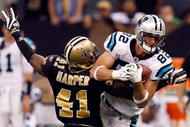 NEW ORLEANS - NOVEMBER 08:  Tight end Gary Barnidge#82 of the Carolina Panthers makes a pass reception against Roman Harper #41 of the New Orleans Saints at Louisiana Superdome on November 8, 2009 in New Orleans, Louisiana.  (Photo by Ronald Martinez/Getty Images)