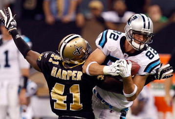 NEW ORLEANS - NOVEMBER 08:  Tight end Gary Barnidge#82 of the Carolina Panthers makes a pass reception against Roman Harper #41 of the New Orleans Saints at Louisiana Superdome on November 8, 2009 in New Orleans, Louisiana.  (Photo by Ronald Martinez/Getty Images)