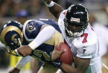 6 Jan 2002: Michael Vick #7 of the Atlanta Falcons scrambles as Chidi Ahanotu #72 of the St. Louis Rams defends at the Dome at America's Center in St. Louis, Missouri. The St. Louis Rams beat the Atlanta Falcons 31-13.  DIGITAL IMAGE. Mandatory Credit: Elsa /Getty Images