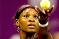 DOHA, QATAR - NOVEMBER 01: Serena Williams of the United States serves to Venus Williams of the United States during the final of the Sony Ericsson WTA Championships at the Khalifa International Tennis and Squash Complex on November 1, 2009 in Doha, Qatar. (Photo by Matthew Stockman/Getty Images)