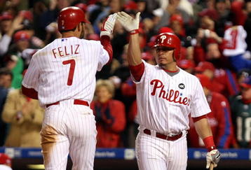 PHILADELPHIA - NOVEMBER 01:  (L-R) Pedro Feliz #7 and Carlos Ruiz #51 of the Philadelphia Phillies celebrate after Feliz scored on his solo home run in the bottom of the eighth inning against the New York Yankees in Game Four of the 2009 MLB World Series at Citizens Bank Park on November 1, 2009 in Philadelphia, Pennsylvania.  (Photo by Al Bello/Getty Images)