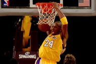 LOS ANGELES - NOVEMBER 6: Kobe Bryant #24 of the Los Angeles Lakers dunks over Marc Gasol #33 and Rudy Gay #22 of the Memphis Grizzlies on November 6, 2009 at Staples Center in Los Angeles, California. The Lakers won 114-98. NOTE TO USER: User expressly acknowledges and agrees that, by downloading and/or using this Photograph, user is consenting to the terms and conditions of the Getty Images License Agreement. (Photo by Stephen Dunn/Getty Images)