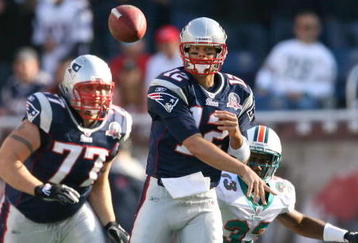 FOXBORO, MA - NOVEMBER 8:  Tom Brady #12 of the New England Patriots throws against the Miami Dolphins at Gillette Stadium on November 8, 2009 in Foxboro, Massachusetts.  (Photo by Jim Rogash/Getty Images)