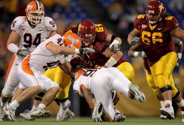 MINNEAPOLIS, MN - NOVEMBER 03:  Quarterback Adam Weber #8 of the Minnesota Golden Gophers is sacked by Antonio James #90 of the Illinois Fighting Illini as J Leman #47 of the Illini and Steve Shindell #64 of the Gophers join the play at the Hubert H. Humphrey Metrodome on November 3, 2007 in Minneapolis, Minnesota.  (Photo by Doug Pensinger/Getty Images)