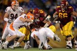 MINNEAPOLIS, MN - NOVEMBER 03:  Quarterback Adam Weber #8 of the Minnesota Golden Gophers is sacked by Antonio James #90 of the Illinois Fighting Illini as J Leman #47 of the Illini and Steve Shindell #64 of the Gophers join the play at the Hubert H. Humphrey Metrodome on November 3, 2007 in Minneapolis, Minnesota.  (Photo by Doug Pensinger/Getty Images)