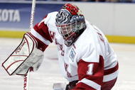 MILWAUKEE - APRIL 06:  Brian Elliott #1 of the Wisconsin Badgers stops a shot by the Maine Black Bears during the NCAA Frozen Four on April 6, 2006 at the Bradley Center in Milwaukee, Wisconsin. Wisconsin defeated Maine 5-2.  (Photo by Elsa/Getty Images)