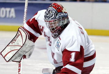 MILWAUKEE - APRIL 06:  Brian Elliott #1 of the Wisconsin Badgers stops a shot by the Maine Black Bears during the NCAA Frozen Four on April 6, 2006 at the Bradley Center in Milwaukee, Wisconsin. Wisconsin defeated Maine 5-2.  (Photo by Elsa/Getty Images)